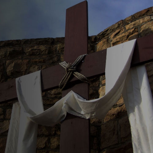 Wooden cross with white cloth draped across